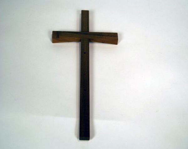 Custom wood mouldings made into a wooden cross with a clear satin finish, available in bulk.